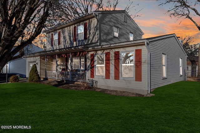 view of front facade with covered porch and a front lawn