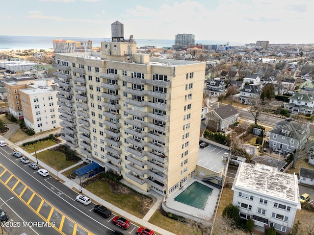 view of property featuring a view of city and a water view