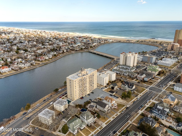 bird's eye view featuring a water view and a city view