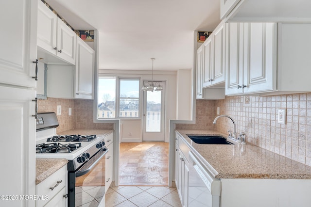 kitchen featuring a sink, white cabinetry, decorative backsplash, dishwasher, and gas range oven