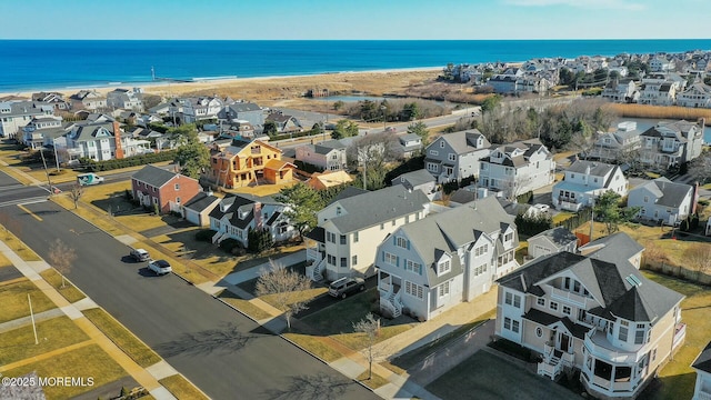 aerial view featuring a residential view and a water view