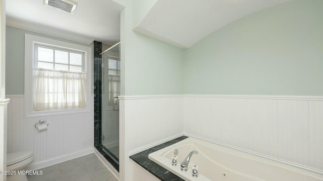 full bath featuring visible vents, toilet, a stall shower, wainscoting, and a jetted tub