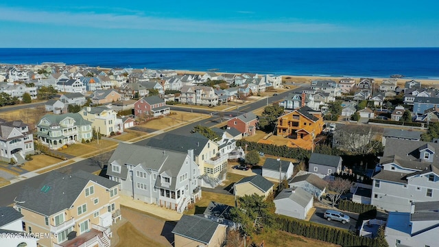 bird's eye view featuring a water view and a residential view