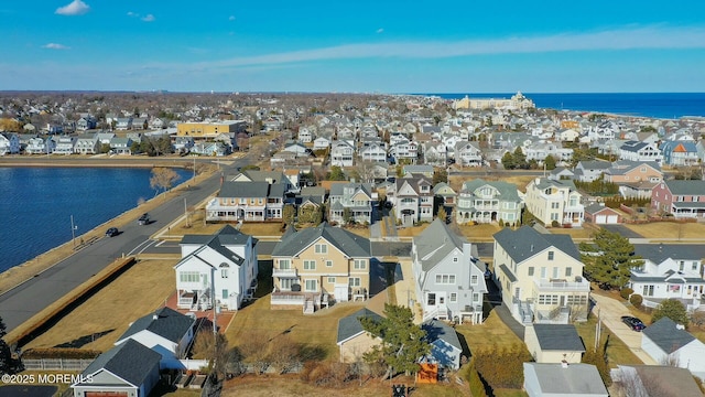 aerial view with a water view and a residential view