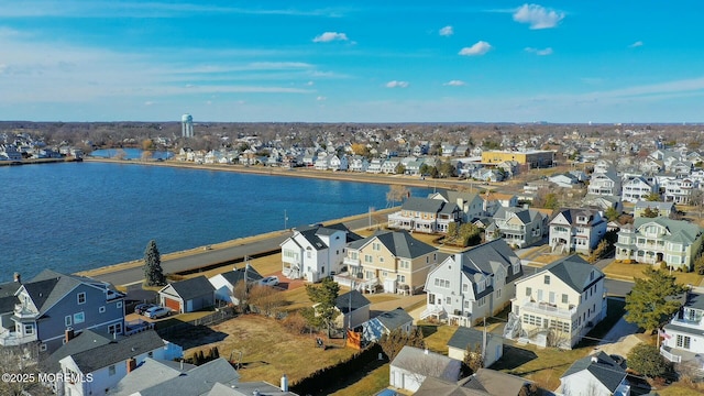 bird's eye view with a water view and a residential view