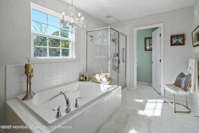 full bathroom with tile patterned flooring, a shower stall, baseboards, and a bath