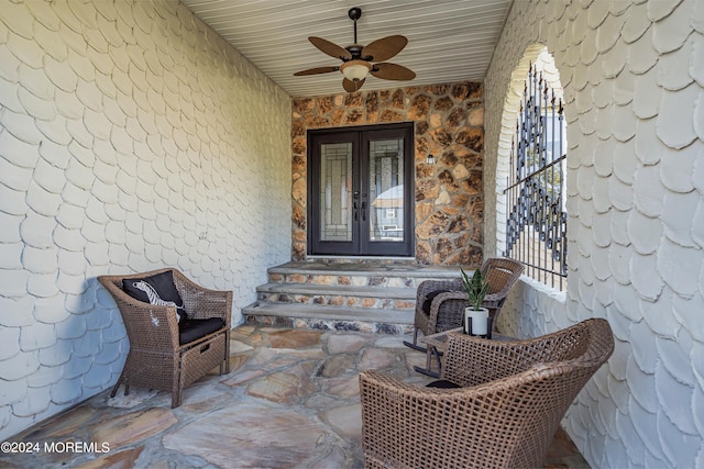 property entrance featuring ceiling fan and french doors