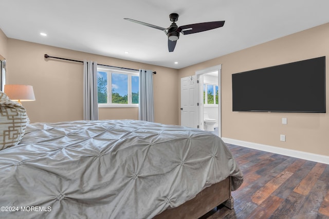 unfurnished bedroom featuring hardwood / wood-style flooring, multiple windows, and baseboards