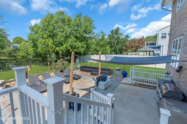 view of patio / terrace featuring a fenced backyard and an outdoor living space