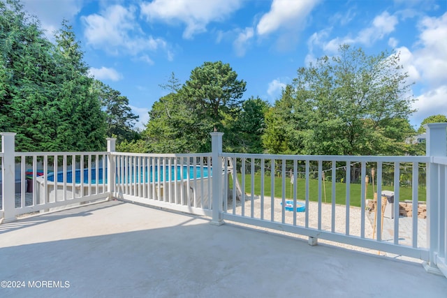 view of patio / terrace with a fenced in pool