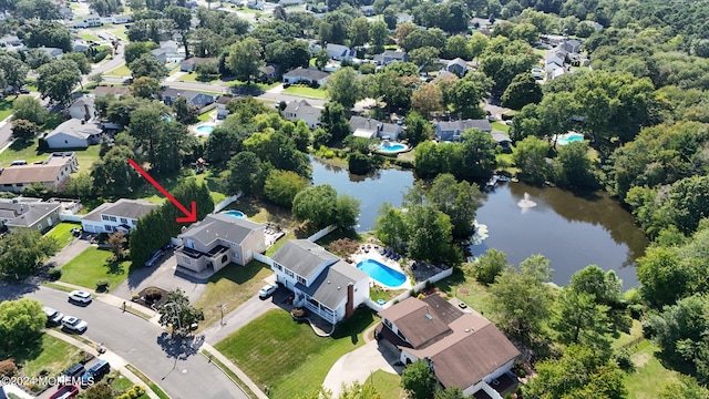 aerial view with a residential view and a water view