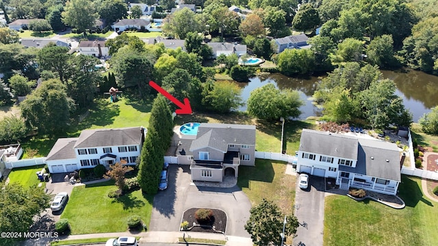 bird's eye view featuring a water view and a residential view