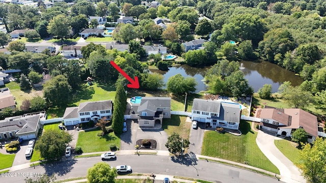 aerial view featuring a residential view and a water view