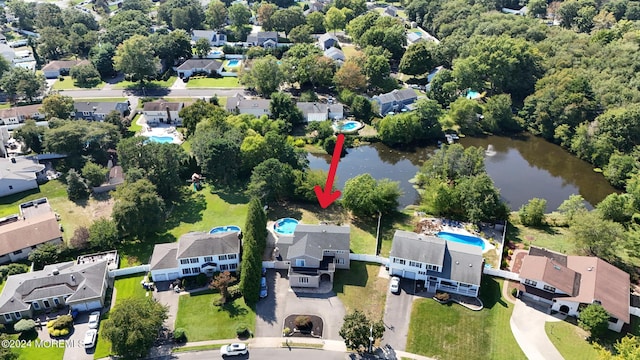 aerial view with a residential view and a water view