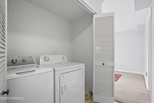 laundry room with laundry area, baseboards, separate washer and dryer, and light colored carpet