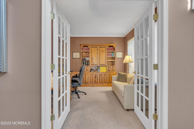 office area featuring light colored carpet, crown molding, and french doors