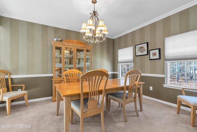 dining area featuring baseboards, crown molding, light carpet, and wallpapered walls