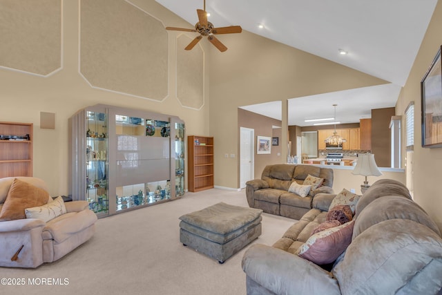 living room with ceiling fan, lofted ceiling, and light colored carpet