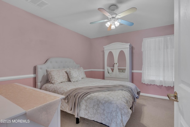 bedroom featuring a ceiling fan, carpet, visible vents, and baseboards