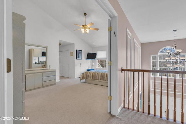 bedroom with a chandelier, carpet flooring, and lofted ceiling