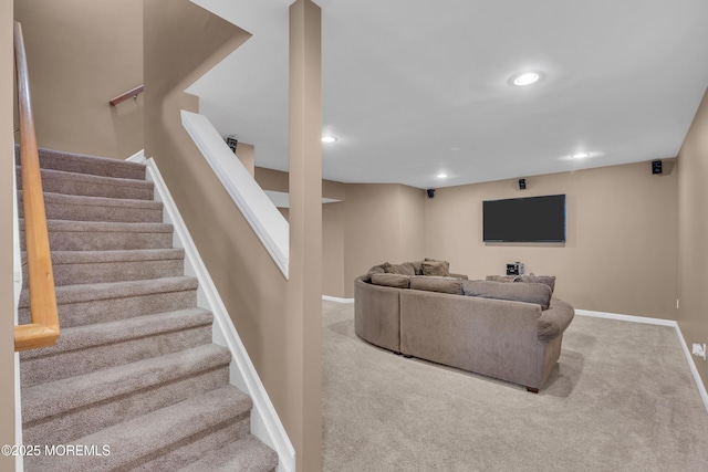 carpeted living area with recessed lighting, baseboards, and stairs