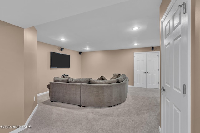 living room featuring carpet, baseboards, and recessed lighting