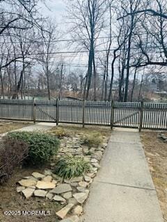 view of gate featuring fence