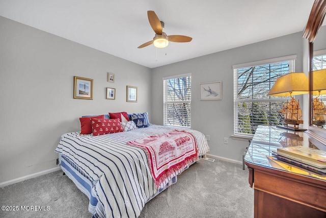 bedroom featuring ceiling fan, carpet flooring, and baseboards