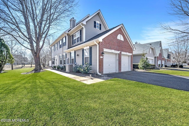 view of property exterior with aphalt driveway, central air condition unit, brick siding, a lawn, and a chimney