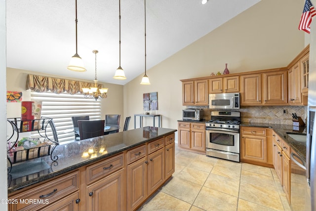 kitchen with tasteful backsplash, brown cabinets, decorative light fixtures, an inviting chandelier, and stainless steel appliances