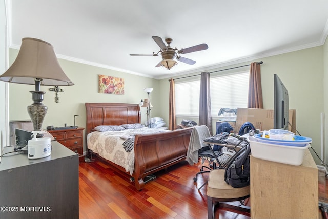 bedroom with ornamental molding, a ceiling fan, and wood finished floors