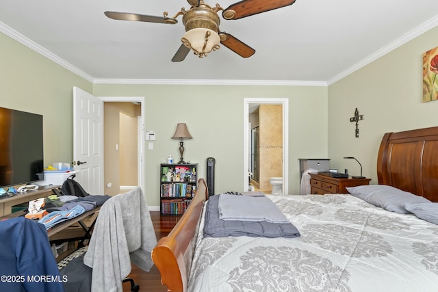 bedroom featuring ceiling fan, wood finished floors, baseboards, ensuite bath, and crown molding