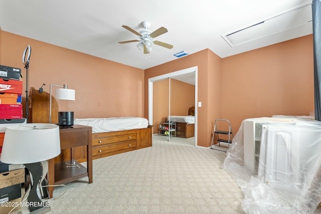 carpeted bedroom with a ceiling fan