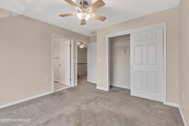 unfurnished bedroom featuring carpet floors, a closet, ceiling fan, and baseboards