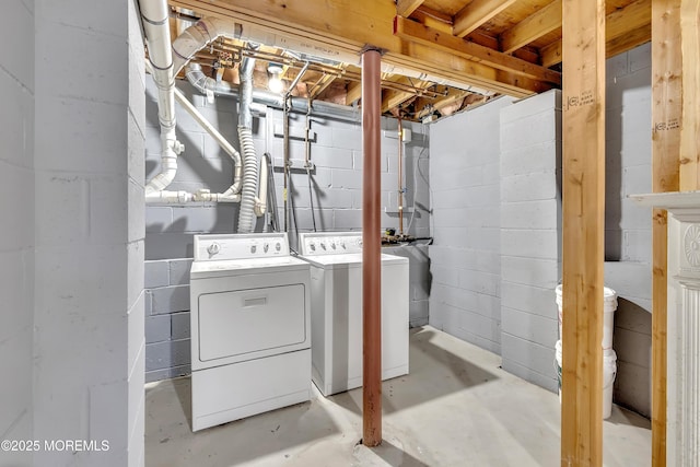 clothes washing area featuring laundry area and washing machine and dryer