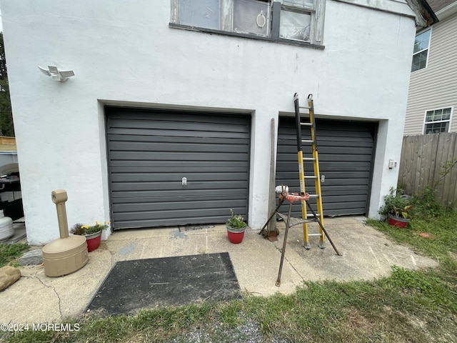 garage with fence