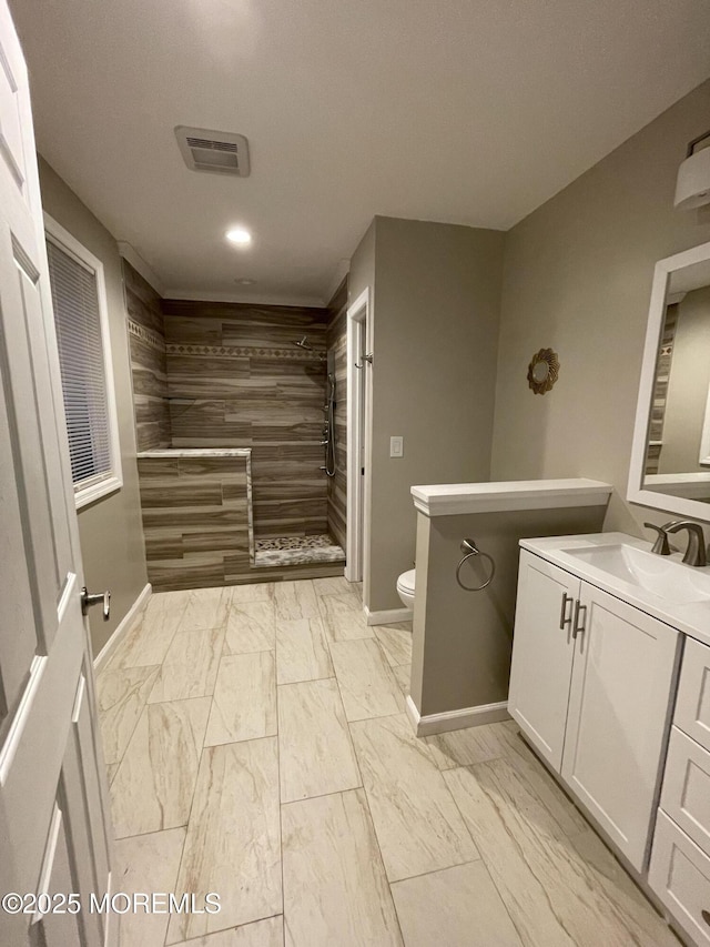 123 Harbor Inn Rd, Bayville, NJ 08721 - bathroom with a tile shower, baseboards, toilet, vanity, and marble finish flooring