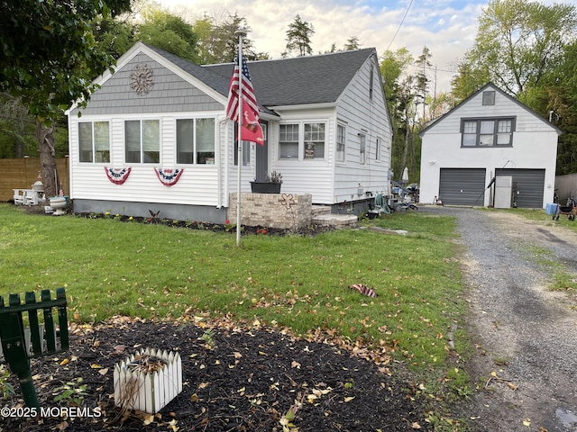 123 Harbor Inn Rd, Bayville, NJ 08721 - view of front of home featuring a garage, an outdoor structure, a front yard, and roof with shingles