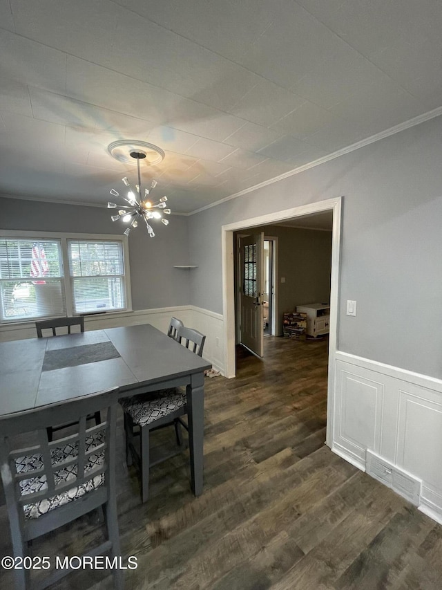 123 Harbor Inn Rd, Bayville, NJ 08721 - dining area with ornamental molding, a chandelier, wainscoting, dark wood-type flooring, and a decorative wall