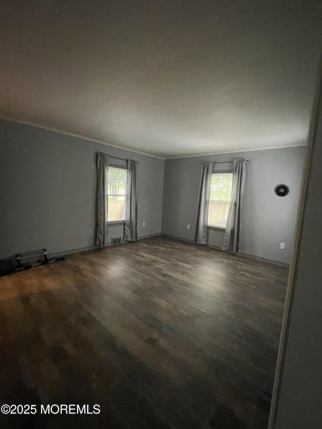 123 Harbor Inn Rd, Bayville, NJ 08721 - spare room with plenty of natural light, crown molding, and dark wood finished floors