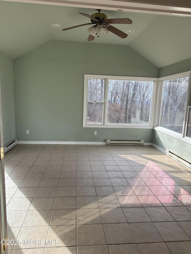unfurnished room with vaulted ceiling, a baseboard heating unit, and tile patterned flooring