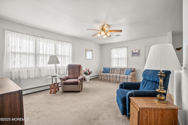 living room featuring a baseboard radiator, visible vents, ceiling fan, and carpet flooring