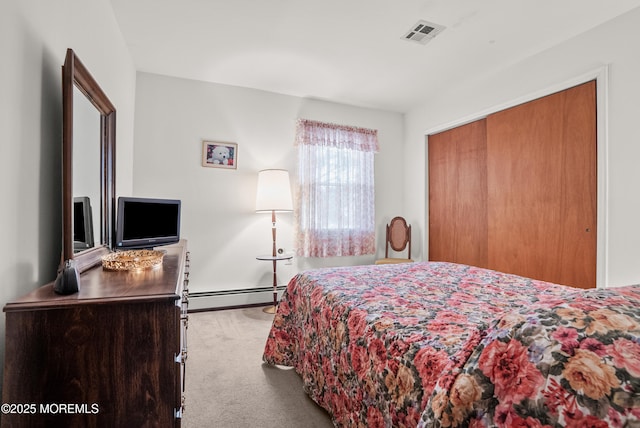 bedroom featuring carpet floors, a closet, a baseboard radiator, and visible vents