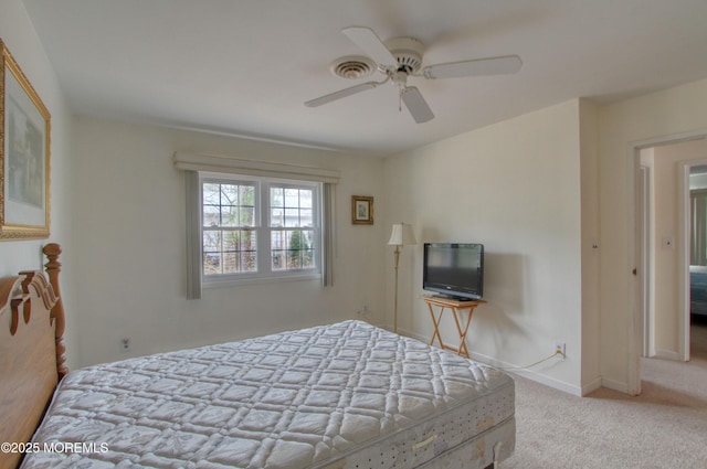 carpeted bedroom featuring ceiling fan and baseboards