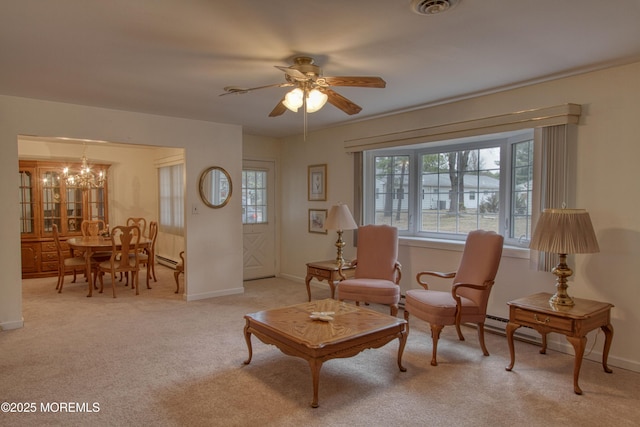 sitting room featuring light carpet, visible vents, baseboards, and ceiling fan with notable chandelier