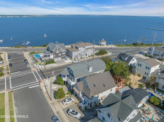 birds eye view of property with a residential view and a water view