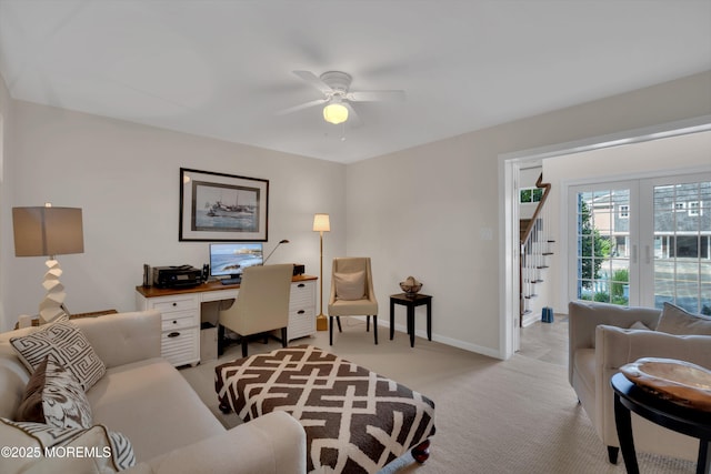 home office with ceiling fan, baseboards, and light colored carpet