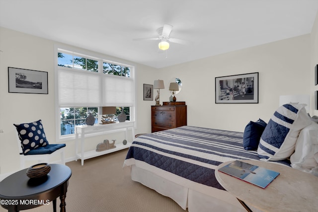 bedroom featuring ceiling fan and carpet