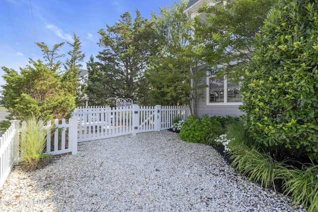 view of gate featuring fence