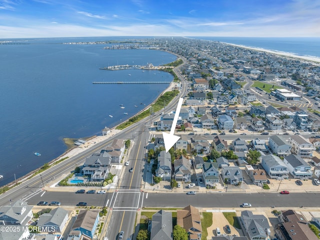 aerial view featuring a water view and a residential view